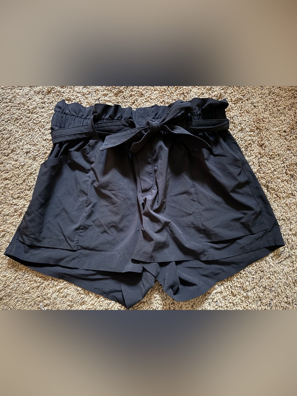 Athlete size 4 black shorts paper bag wait